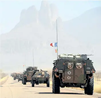  ??  ?? A convoy of French army vehicles head toward Gao, Mali, on Feb. 7, 2013 on the road from Gossi. One of the reasons Canadian forces would prefer to go to Mali may be because that is where the French have the most troops and the most robust military...