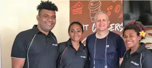  ?? Feedback: frederica.elbourne@ fijisun.com.fj ?? British Deputy High Commission­er to Fiji Paul Welsh (third from left) dropped in at Gloria Jean’s after his morning run yesterday for coffee and croissants, where he was asked by staff for a group photo.