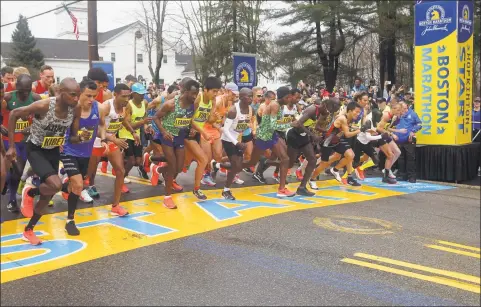  ?? Stew Milne / Associated Press ?? The elite men break from the start of the 123rd Boston Marathon last year in Hopkinton, Mass. The 2020 Boston Marathon, which was reschedule­d to be run on Sept. 14, was canceled Thursday for the first time in its 124-year history due to the COVID-19 virus outbreak.