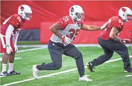  ?? TOM TINGLE/AZCENTRAL SPORTS ?? The Cardinals’ Elijhaa Penny (35) runs special teams drills during practice at the Tempe training facility on Aug. 28.