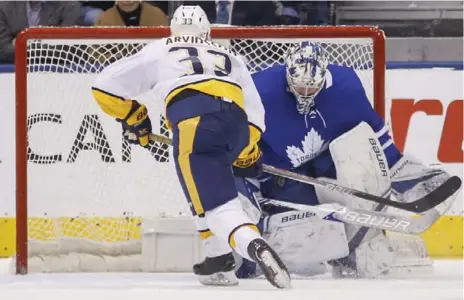  ?? RICK MADONIK/TORONTO STAR ?? Leafs goaltender Frederik Andersen stops Nashville winger Viktor Arvidsson in the seventh round of the shootout to seal the Toronto win.