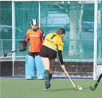  ?? ?? Gulls player Charlotte Smith sprints towards goal, getting it past Drouids’ goalie Vanessa McDonald to score a goal. Gulls won 6-0.