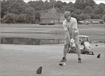  ?? Doug Walker ?? Chris Wooden, Sandy Springs, tees off on the first hole at the Barnsley Resort on Thursday. The resort near Adairsvill­e reopened June 12 after a nearly three-month shutdown due to the COVID-19 pandemic.