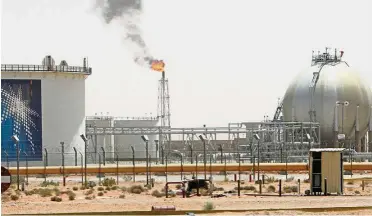  ??  ?? Production cut: A gas flame is seen in the desert near the Khurais oilfield, Saudi Arabia. The country is limiting cargoes to Asia, a prized market where it’s facing competitio­n from rivals including the US, to implement an output-cut plan aimed at...