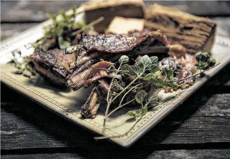  ?? Daniel Carde / Contributo­r ?? For best results, treat lamb ribs like smoked pork ribs.