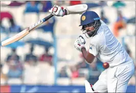  ??  ?? Sri Lankan batsman Thirimanne plays a shot during the third day of 1st Test match against India at Eden Gardens, on Saturday.