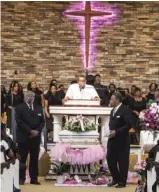  ??  ?? LEFT: The Rev. Warren C. Dorris Jr. speaks during Friday’s service at Prayer Tower Ministries Church in Joliet.