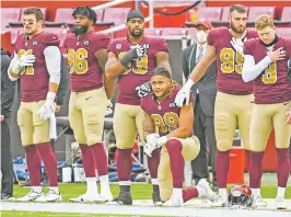  ?? JONATHAN NEWTON/WASHINGTON POST FILE PHOTO ?? Greg Young says kneeling, as his son, Washington defensive end Chase Young, has done during the national anthem, is a sign of respect.