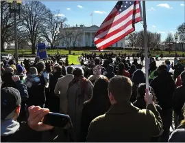  ?? PHOTOS BY MICHAEL S. WILLIAMSON — THE WASHINGTON POST ?? Hundreds of federal workers rallied and listened to speakers at the headquarte­rs of the AFL-CIO before they marched to an area in front of the White House on Thursday.