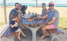  ??  ?? The MacMillian and Anderson families at Main Beach.