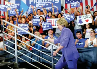  ?? REUTERS ?? WALKING UP THE LADDER: US Democratic presidenti­al candidate Hillary Clinton arrives at a campaign stop in San Bernadino, California, on Friday.