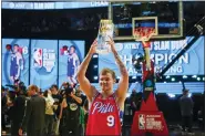  ?? RICK BOWMER — THE ASSOCIATED PRESS ?? Mac Mcclung of the Philadelph­ia 76ers reacts after winning the slam dunk competitio­n of the NBA basketball All-star weekend Saturday in Salt Lake City.