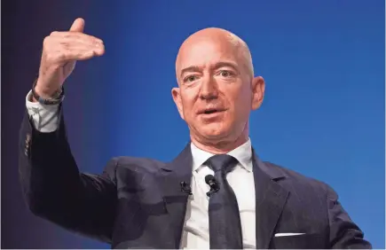  ?? AFP/GETTY IMAGES ?? Jeff Bezos says he won’t be a party to AMI’s “well-known practice of blackmail (and) political attacks.”