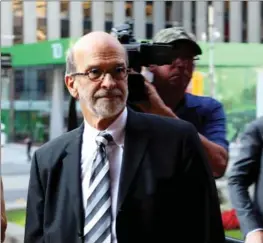  ?? COLIN N. PERKEL, THE CANADIAN PRESS ?? David Livingston, chief of staff to former Ontario premier Dalton McGuinty, arrives at court in Toronto on Friday. Livingston and his deputy Laura Miller are on trial for breach of public trust.