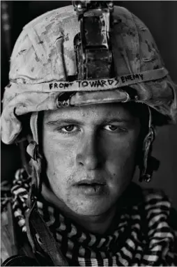  ??  ?? US Marine Lance Corporal Damon ‘Commie’ Connell at Forward Operating Base Apache North after a patrol in Garmsir district, Helmand province, 2008; photograph by Louie Palu from War Is Only Half the Story: Ten Years of the Aftermath Project, edited by Sara Terry and Teun van der Heijden and published by Dewi Lewis. A traveling exhibition will be on view at the University of Baltimore’s Albin O. Kuhn Library and Gallery, April 2–May 26, 2018.