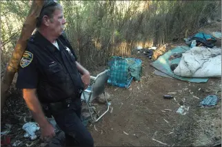  ?? FRANKIE FROST — MARIN INDEPENDEN­T JOURNAL ?? Mark Hedeen, a former San Rafael Police Department officer and ranger, stands by a campsite on San Rafael Hill in 2007. Police and members of the Marin Conservati­on Corps cleared the hill of potential fire hazards such as brush and camp materials.