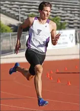  ?? Katharine Lotze/The Signal ?? Valencia’s Sam Pica rounds the second turn of the boys varsity 400 meter dash at the Foothill League track and field finals at College of the Canyons on Thursday. Pica won the event and set a meet record.