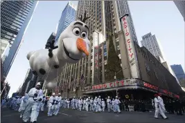  ?? MARY ALTAFFER — THE ASSOCIATED PRESS ?? A balloon floats past Radio City Music Hall during the 92nd annual Macy’s Thanksgivi­ng Day Parade in New York.