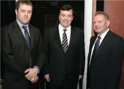  ??  ?? Tommy with the late forrmer minister Brian Lenihan and Thomas Byrne TD. Right, Tommy in his soccer days.