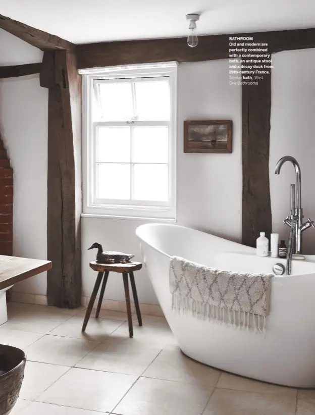  ??  ?? BATHROOM
Old and modern are perfectly combined with a contempora­ry bath, an antique stool and a decoy duck from 19th-century France.
Similar bath, West One Bathrooms