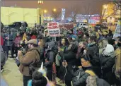  ?? TERRENCE ANTONIO JAMES/CHICAGO TRIBUNE ?? Mourners gather Friday at Lane Tech High School in Chicago for a vigil for Jemel Roberson.