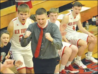  ?? Staff photo/Jake Dowling ?? New Knoxville head coach Cole Fischbach celebrates in the final seconds of Friday’s Midwest Athletic Conference boys basketball game against Delphos St. John’s as the Rangers snapped a 30-game MAC losing skid.