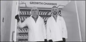  ?? FiLE PHOTO ?? Gregg Curwin, president and CEO of GoodLeaf Farms, left, and Greg Veinott, manager of research and commercial­ization, exit the chamber where greens are grown at GoodLeaf Farms.