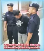  ??  ?? DIDAKWA: Tertuduh ketika dibawa ke Mahkamah Sesyen Kuching semalam.