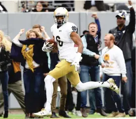  ?? | ELSA/ GETTY IMAGES ?? Notre Dame wide receiver Equanimeou­s St. Brown’s strength and speed impressed observers at the NFL Scouting Combine.