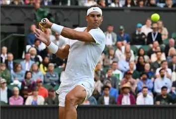  ?? Getty Images ?? Rafael Nadal beat Botic van de Zandschulp Monday to reach the Wimbledon quarterfin­als in London.