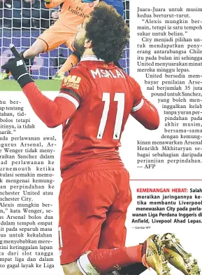  ?? — Gambar AFP ?? KEMENANGAN HEBAT: Salah meraikan jaringanny­a ketika membantu Liverpool menewaskan City pada perlawanan Liga Perdana Inggeris di Anfield, Livepool Ahad Lepas.