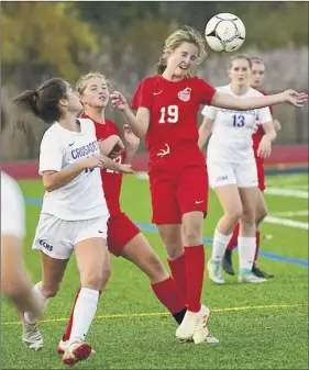  ?? Lori Van Buren / times union ?? mechanicvi­lle’s marissa Krosky heads the ball against Catholic Central during their Section ii Class B tournament game thursday.