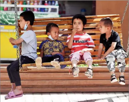  ?? WEI XIAOHAO / CHINA DAILY ?? Children enjoy a day out in Kashgar, Xinjiang Uygur autonomous region.