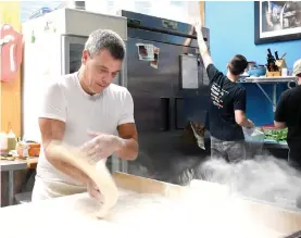  ?? The Sentinel-Record/File photo ?? Anthony Valinoti, owner of Deluca’s Pizzeria, prepares crusts at his restaurant in 2017.