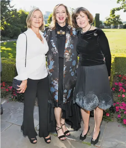  ?? Drew Altizer / Drew Altizer Photograph­y ?? First cousins Kathy Carver (left), Ana Roth and Lolly Menzies celebrate the Filoli centennial at their family's former country estate.