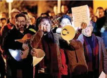  ?? [PHOTOS BY DOUG HOKE, THE OKLAHOMAN] ?? Little Flower Catholic Church parishione­rs sing outside the south Oklahoma Church on Tuesday, the fifth night of Las Posadas, a reenactmen­t of Mary and Joseph’s quest for lodging more than 2,000 years ago.