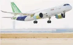  ??  ?? A Comac C919, China’s first medium-haul passenger jet aircraft, takes off from Pudong Internatio­nal Airport in Shanghai. — AFP photo