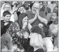  ?? Arkansas Democrat-Gazette/THOMAS METTHE ?? North Little Rock Middle School teacher Dawn McLain (left, center) learns Thursday that she has been named winner of the Milken Educator Award.