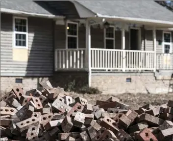  ??  ?? A pile of bricks sits in front of a home scheduled to be raised after being damaged by flooding from Hurricane Florence near the Crabtree Swamp, on Feb. 1, in Conway, S.C. AP PHOTO/SEAN RAYFORD