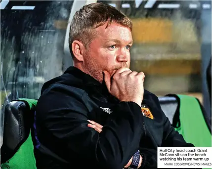  ?? MARK COSGROVE/NEWS IMAGES ?? Hull City head coach Grant Mccann sits on the bench watching his team warm up