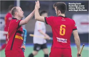  ??  ?? Roaring back: Banbridge scorer Johnny McKee (6) with Hugh McShane