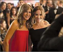  ?? Apple TV Plus/AP ?? Jennifer Aniston (left) and Reese Witherspoo­n appear in a scene from The Morning Show, behind-the-scenes look at fictional players in the competitiv­e morning broadcast realm.