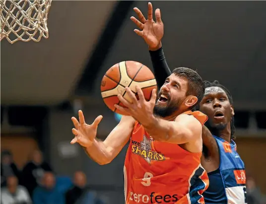  ?? PHOTOSPORT ?? Sharks player Jarrad Weeks goes for the basket during their NBL game against Nelson Giants in Nelson on Friday.