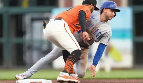  ?? MITCHELL LEFF/GETTY IMAGES ?? Cubs second baseman and leadoff man Nick Madrigal, who was recalled Friday, is tagged out at second in the first inning against the Giants.