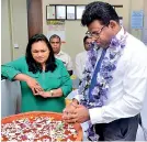  ??  ?? HNB Finance Managing Director and CEO Chaminda Prabath lighting the oil lamp at the opening ceremony