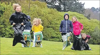  ?? 01a_Broundup01 ?? Youngsters enjoy the sack race at the Easter fun day at Brodick Castle last Sunday. Full report starts on page 11.