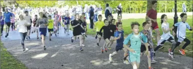  ?? FM4775754 ?? Young runners make their way through the 2km parkrun course in Victoria Gardens