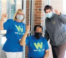  ?? DEPARTMENT WILL COUNTY HEALTH ?? Kenneth, of Bolingbroo­k, wearing Will County’s “We Will Win” logo on his T-shirt, was determined to be the 100,000th person in the county to become fully vaccinated. Health Department Executive Director Sue Olenek, left, and County Executive Jennifer Bertino Tarrant celebrate with him.