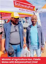  ?? ?? Minister of Agricultur­e Hon. Fidelis Molao with Botswanapo­st Chief Commercial Officer Mr. Clifford Lekoko