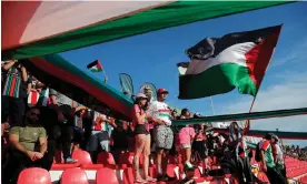  ?? Photograph: Javier Torres/AFP/Getty Images ?? Palestino fans cheer for their team against Everton last week. The club was founded more than a century ago by Palestinia­n migrants.